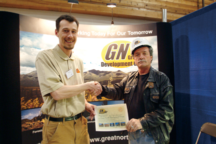 Mike Yuhasz, Great North CEO Mike Yuhasz with trade show attendee - Lions Trade Show, Whitehorse, Yukon, 2004. © Mike Yuhasz all photographs: Robin Armour